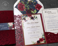 Burgundy Velvet Floral Invitation with gold foil accents and a velvet flocked laser cut lace pocket folder. Navy blue floral accents and floral envelope liners.