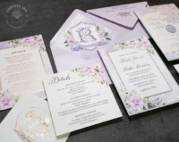 Lavender Floral Watercolor Invitation with metallic gold foil accents, light purple envelopes with monogram crest liners