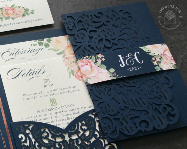 Navy Coral Floral Invitation with rose gold foil imprint on dark blue invitation card. Bright coral flowers and envelopes.