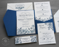 Navy Floral Wildflower Invitation with silver foil in a blue pocket folder