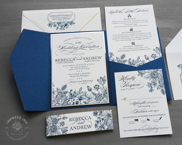 Navy Floral Wildflower Invitation with silver foil in a blue pocket folder