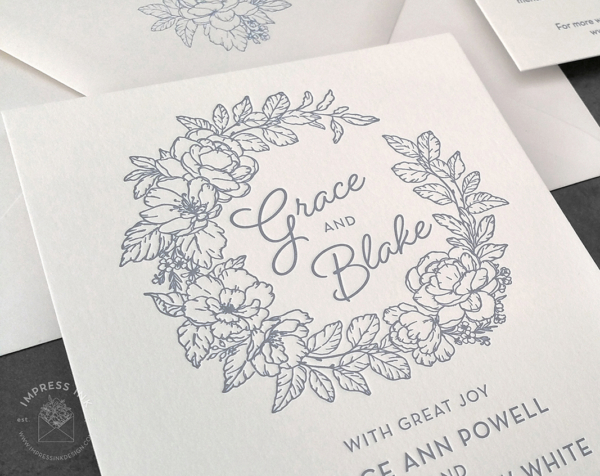 Blue Floral Wreath Invitation with line art flowers in letterpress imprint