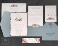 Floral Crest Pocket Invitation with floral printed layering mounted inside a pocket folder
