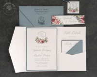 Floral Crest Pocket Invitation with floral monogram mounted inside a pocket folder