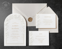 Embossed Floral Arch Invitation with a delicate frame printed in pearl foil. with a garland of blind embossed flowers.