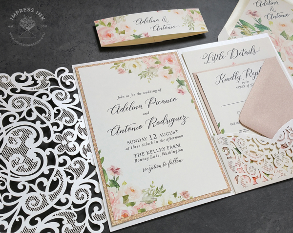 Pink Floral Lace Invitation with pink and cream watercolor flowers mounted with a pink backing layer inside a ivory laser cut lace pocket folder