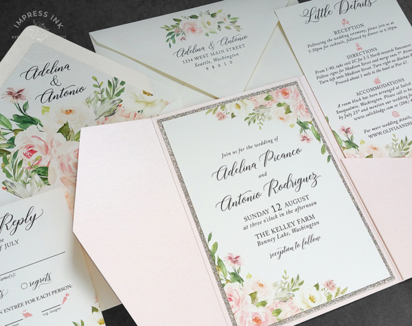 Pink Floral Pocket Invitation with pink and cream watercolor flowers mounted with a gold glitter backing layer inside a light pink pocket folder