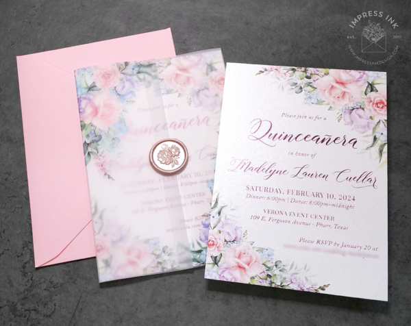 Pastel Floral Quinceañera Invitation with shades of pink, purple, and blue flowers, with Pink foil text and translucent vellum wraps