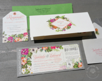Tropical Boarding Pass Invitation with palm leaves and vibrant florals, printed folder and tag shaped reply cards