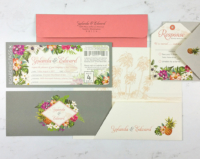 Tropical Boarding Pass Invitation with palm leaves and vibrant florals, printed folder and tag shaped reply cards
