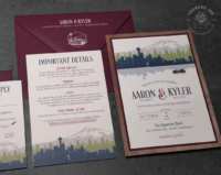 Colorful Seattle Skyline Invitation in shades of navy blue, green, and burgundy, with walnut wood backing layer