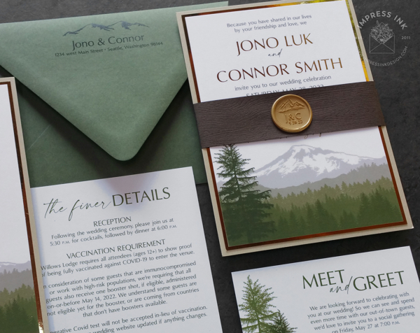Green Cascade Mountains Invitation with landscape silhouette of Mount Rainier in shades of green, woodgrain bands with gold wax seals, seedling green envelopes