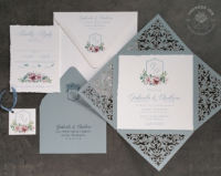 Floral Crest Lace Invitation with monogram, mounted inside an ornate laser cut folder