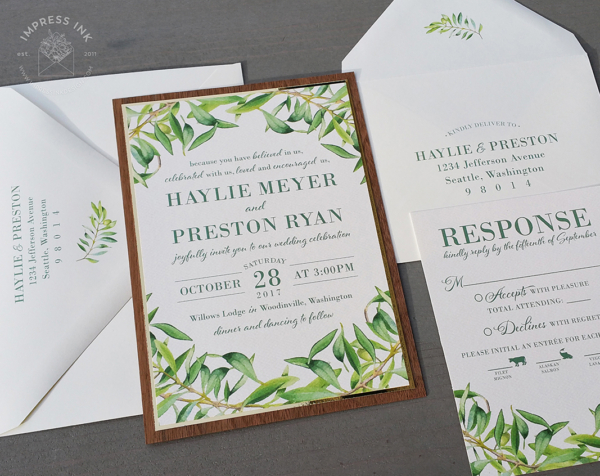 Olive Branch Greenery Invitation with gold and walnut wood backing layers, matching reply cards and printed envelopes