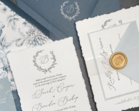 Slate Wreath Monogram Invitation with navy letterpress imprint, hand-torn edges, wax seals and slate blue envelopes