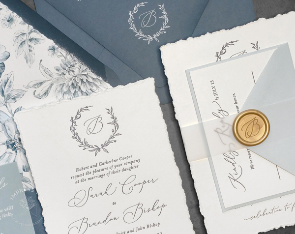 Slate Wreath Monogram Invitation with navy letterpress imprint, hand-torn edges, wax seals and slate blue envelopes