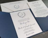 Navy Wreath Pocket Invitation with letterpress imprint and a deep blue pocket folder with white envelopes