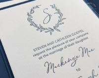 Navy Wreath Pocket Invitation closeup to show letterpress imprint and monogram