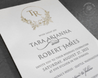 Gold Floral Monogram Invitation with gray letterpress text, and gold foil floral circle monogram