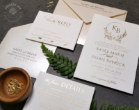 Gold Floral Wreath Invitation with all-over gold foil imprint and shimmery Opal envelopes