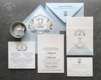 Debossed Monogram Floral Invitation with Azure blue envelopes lined with a blue floral crest
