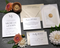 Modern Arch Monogram Invitation printed on shimmery pearl cardstock with black ink
