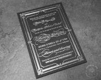 Art Deco Gatsby Invitation with silver foil imprint on black cardstock.