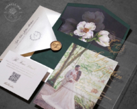 Gold Monogram Acrylic Invitation with greenery wreath in gold print on clear acrylic, green envelopes