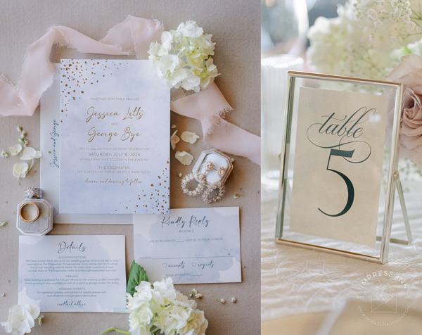 Silver Whimsical Watercolor Invitation with light blue textured background and silver foil imprint with confetti embellishment on the corners, shown with table number signs