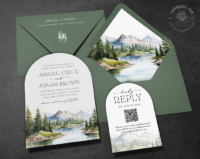 Watercolor Mountain Wilderness Invitation with Cascade inspired watercolor landscape on an arch-shaped card with green envelopes